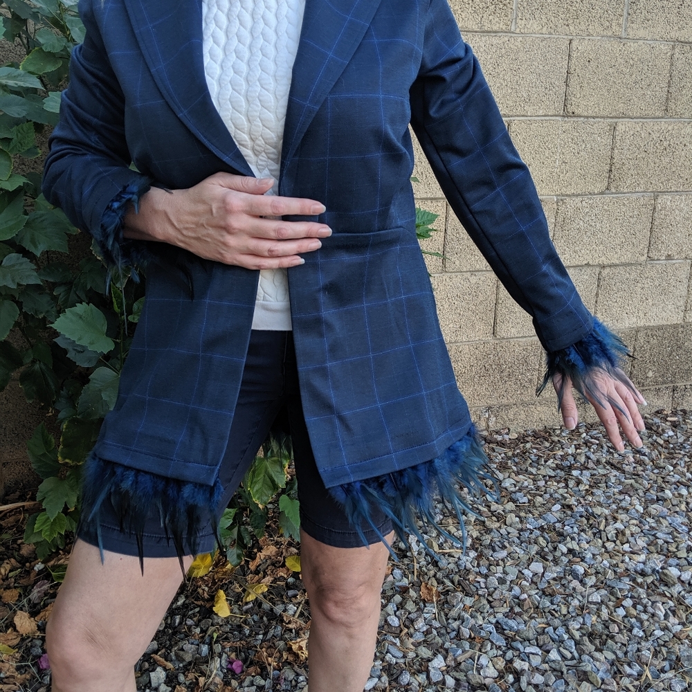 Women's blazer with removable feather trim.